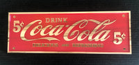 Antique crafted Coca Cola sign.